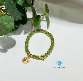 Vòng Peridot 6mm Mix Charm Đồng Si